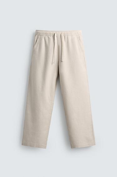 بنطلون RELAXED FIT هيكلي - بيج فاتح الخاص بـ Zara