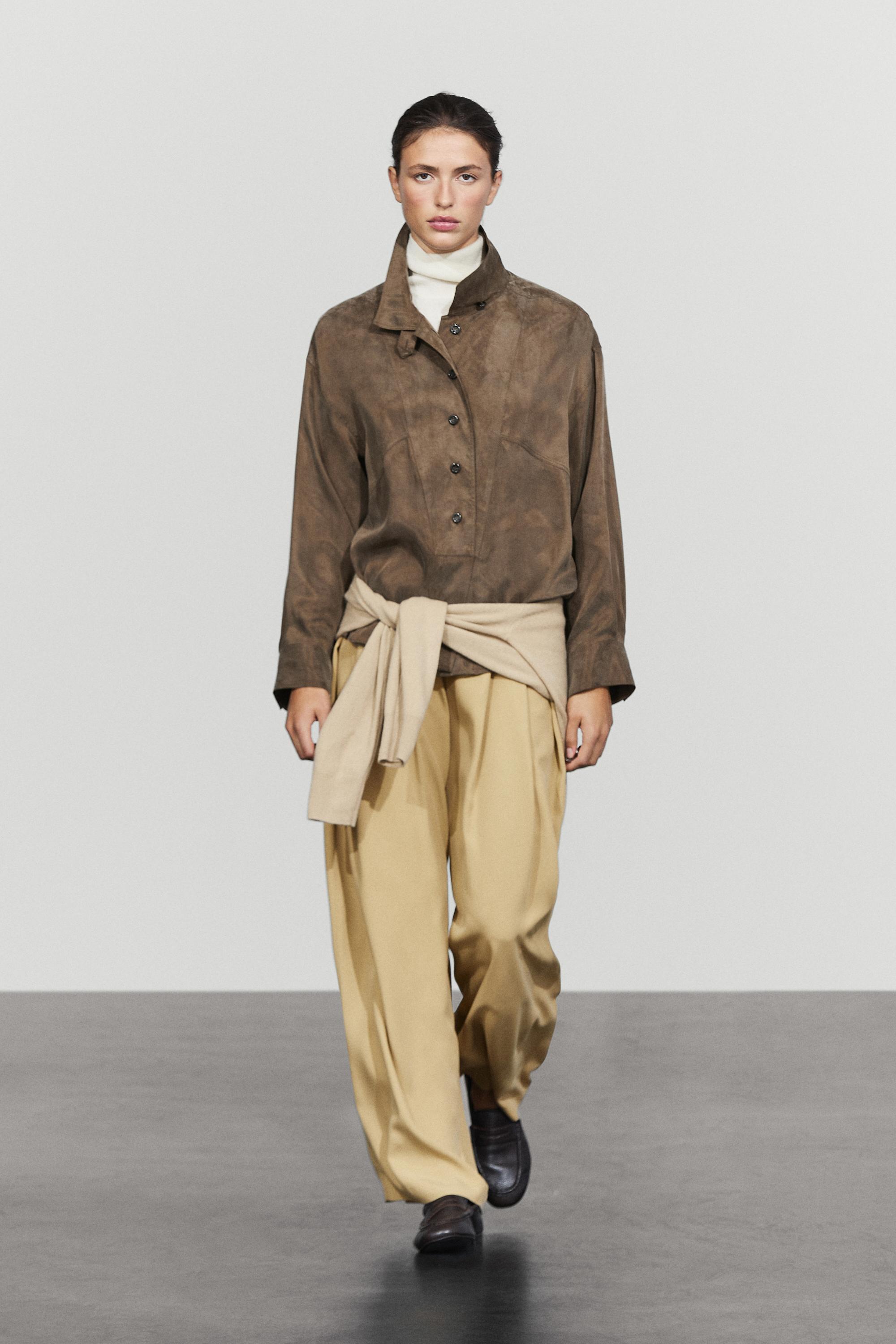 Flowing shirt with stand collar and bib detail