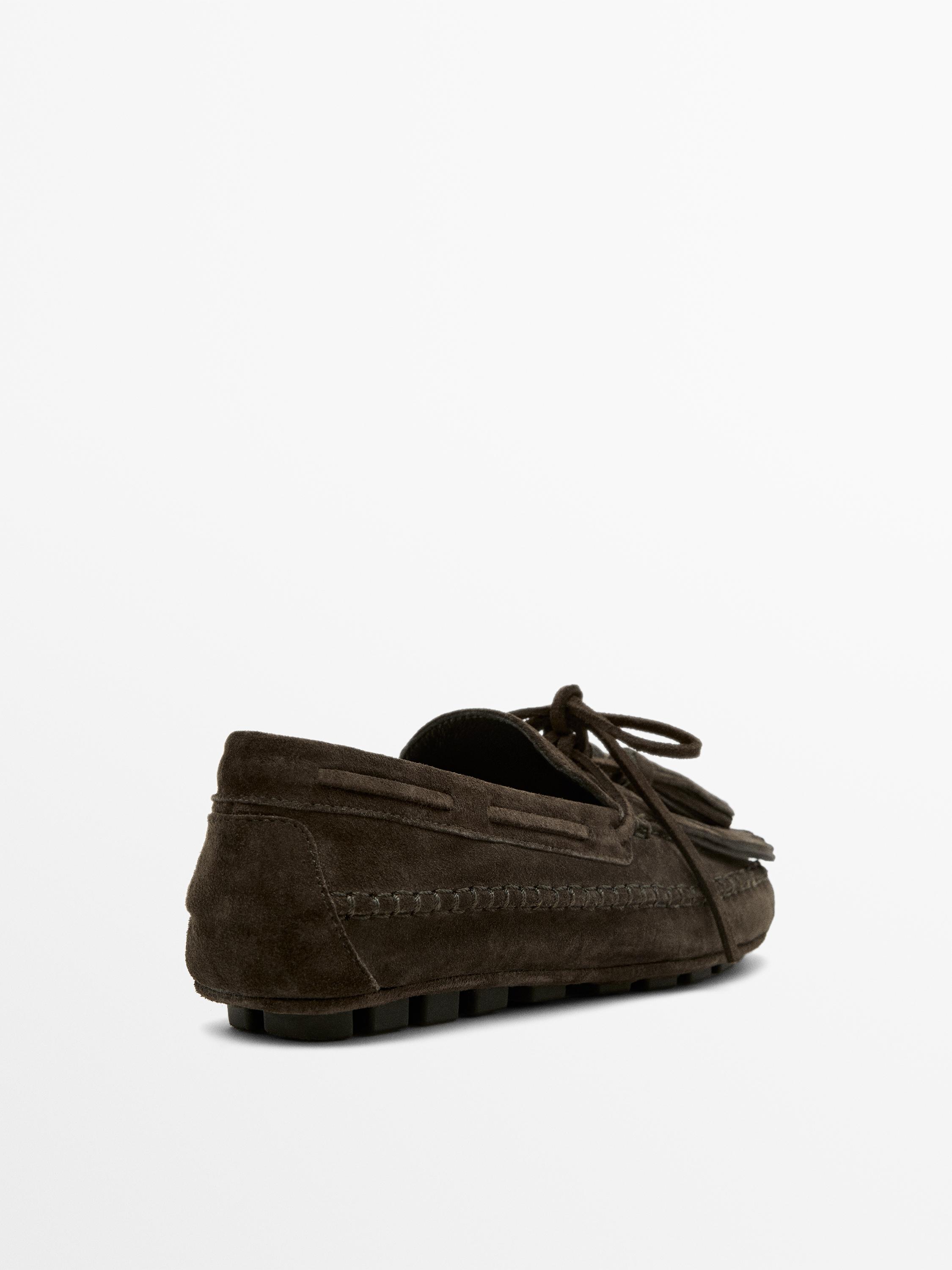 Split suede loafers with fringing and tassels