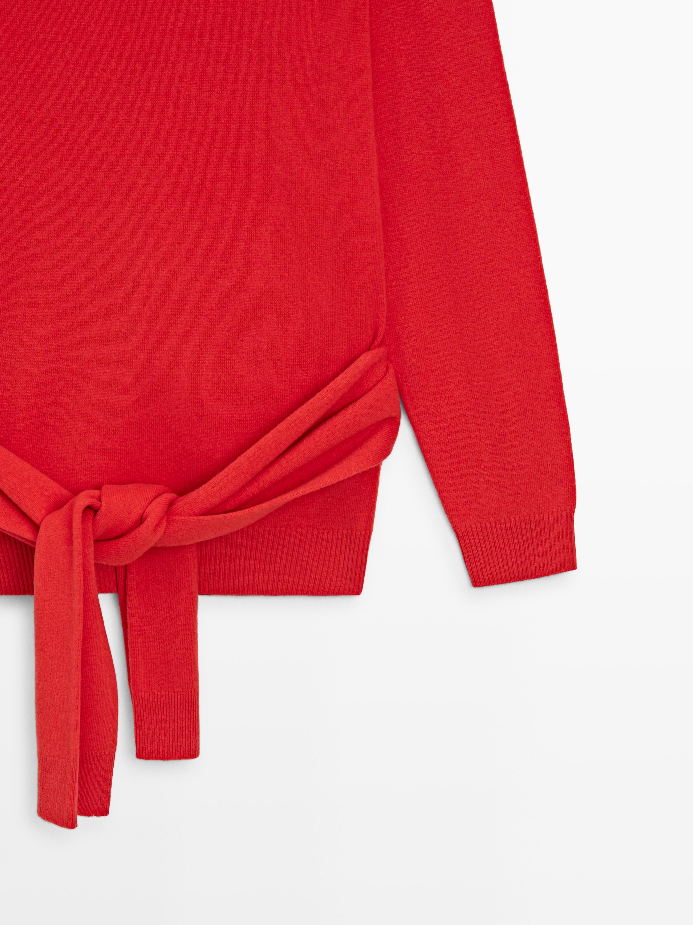 Wool knit sweater with waist detail