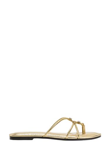 SANDÀLIES TRENADES AMB EFECTE METAL·LITZAT - Daurat de Zara