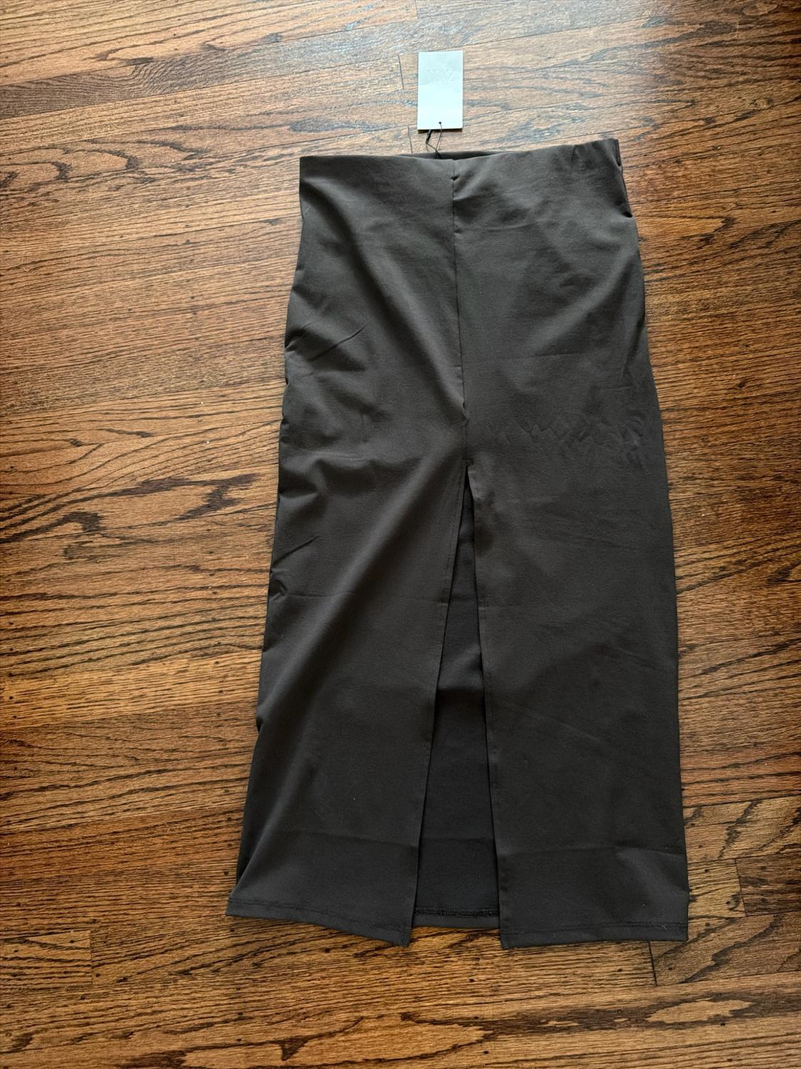 High-waisted midi skirt. Draped fabric detail at waist. Side slit at hem. Back hidden in-seam zip closure. - Image 2