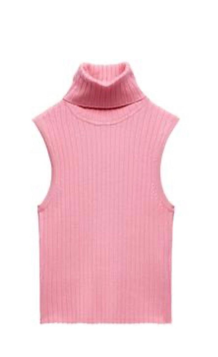 Pink sleeveless ribbed knit top with a high neck on a white background.