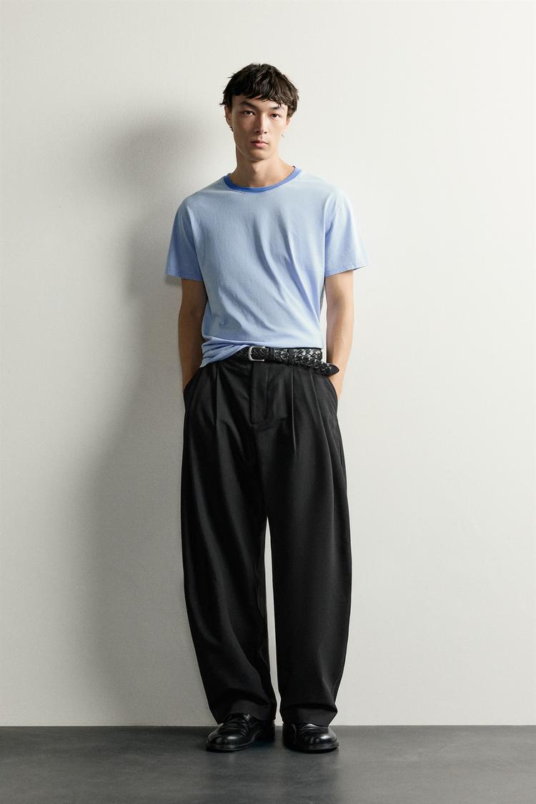 RELAXED FIT PLEATED TROUSERS