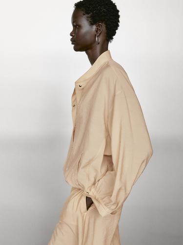 Chaqueta bomber fluida detalle cordón - Beige de Zara