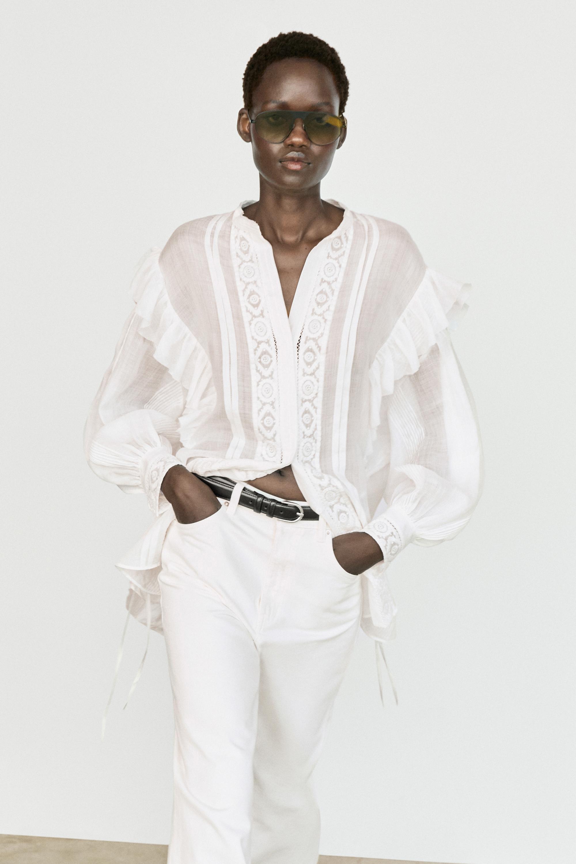 Stand collar blouse with embroidery and ruffles — White