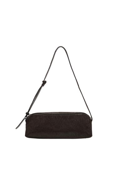 Dark brown rectangular shoulder bag with a furry texture and thin adjustable strap, presented against a white background.