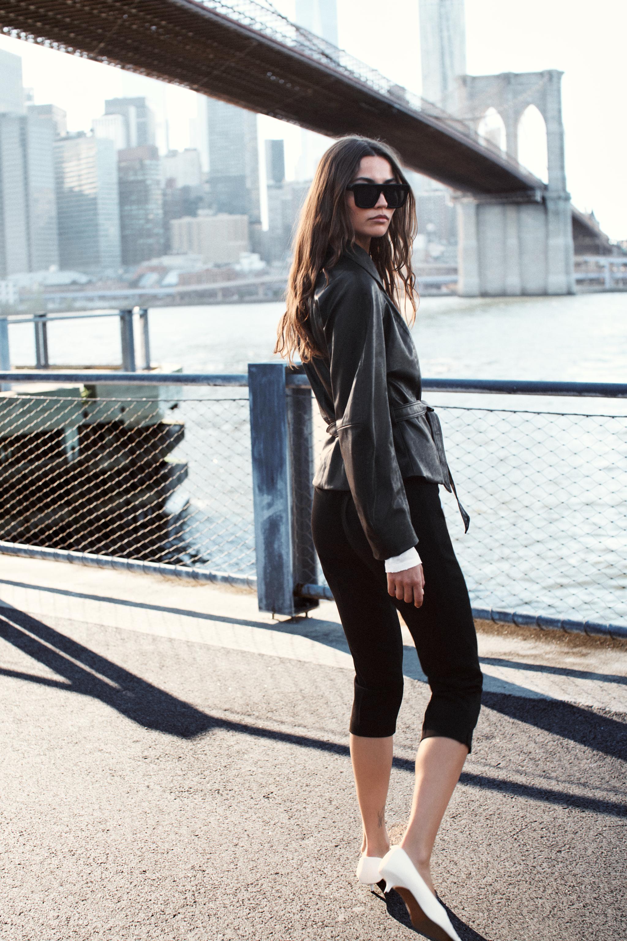 LEATHER-EFFECT BELTED JACKET
