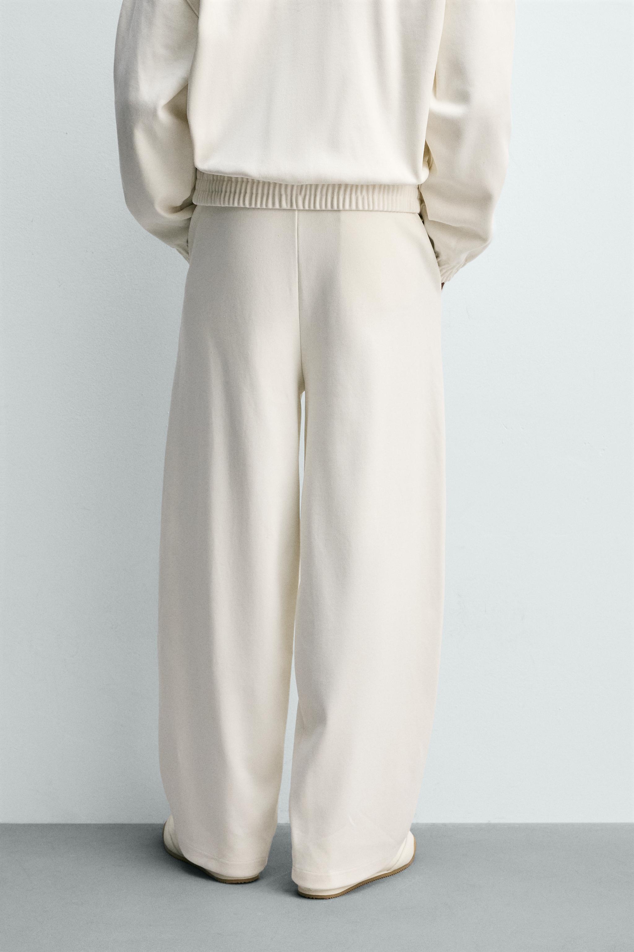 PLEATED WIDE FIT JOGGER PANTS