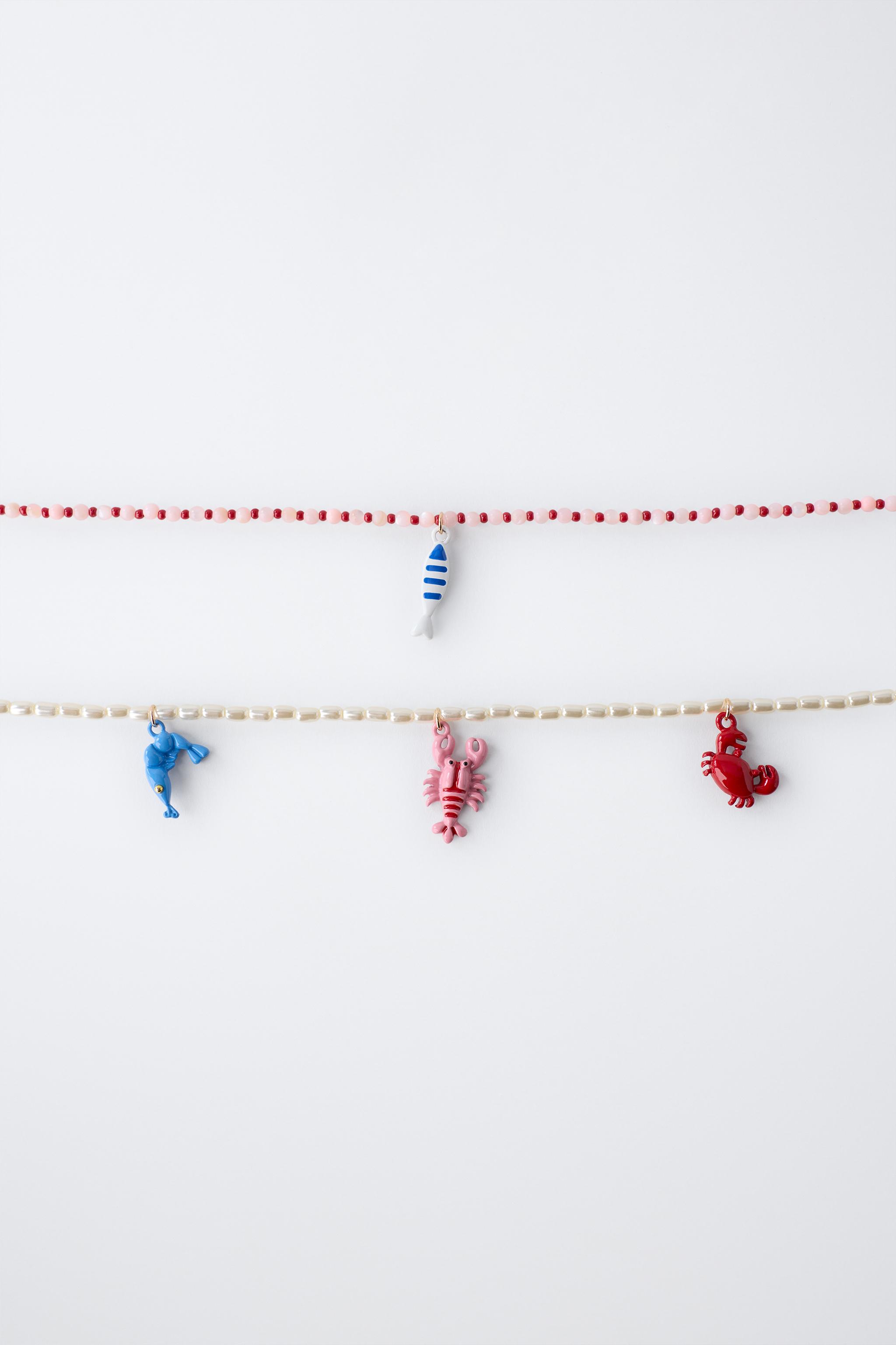LOT DE DEUX COLLIERS PERLES ET FANTAISIE MER
