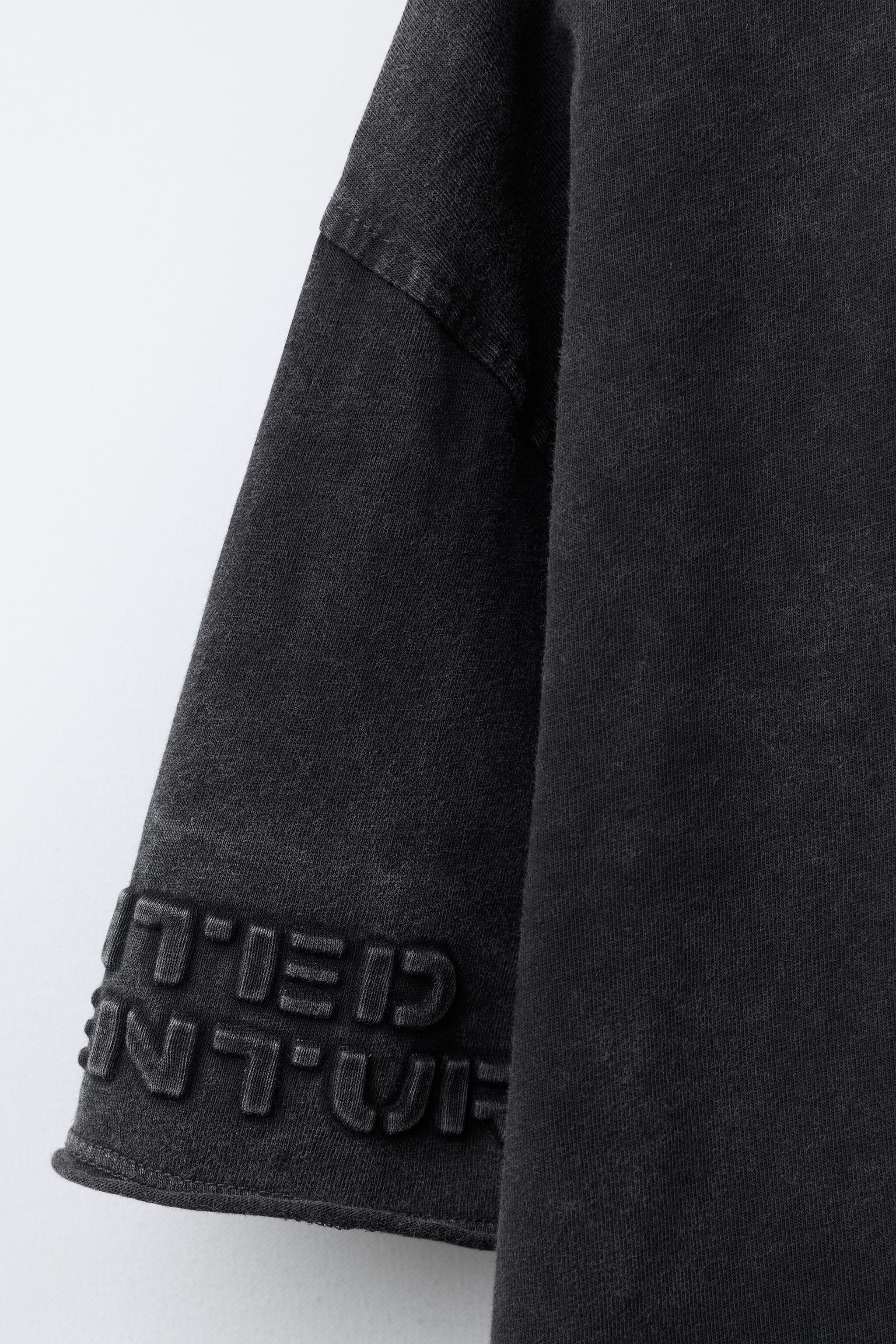 EMBOSSED TEXT T-SHIRT