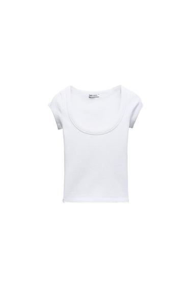 White short-sleeved T-shirt with a round neck on a white background. Visible label on the collar.