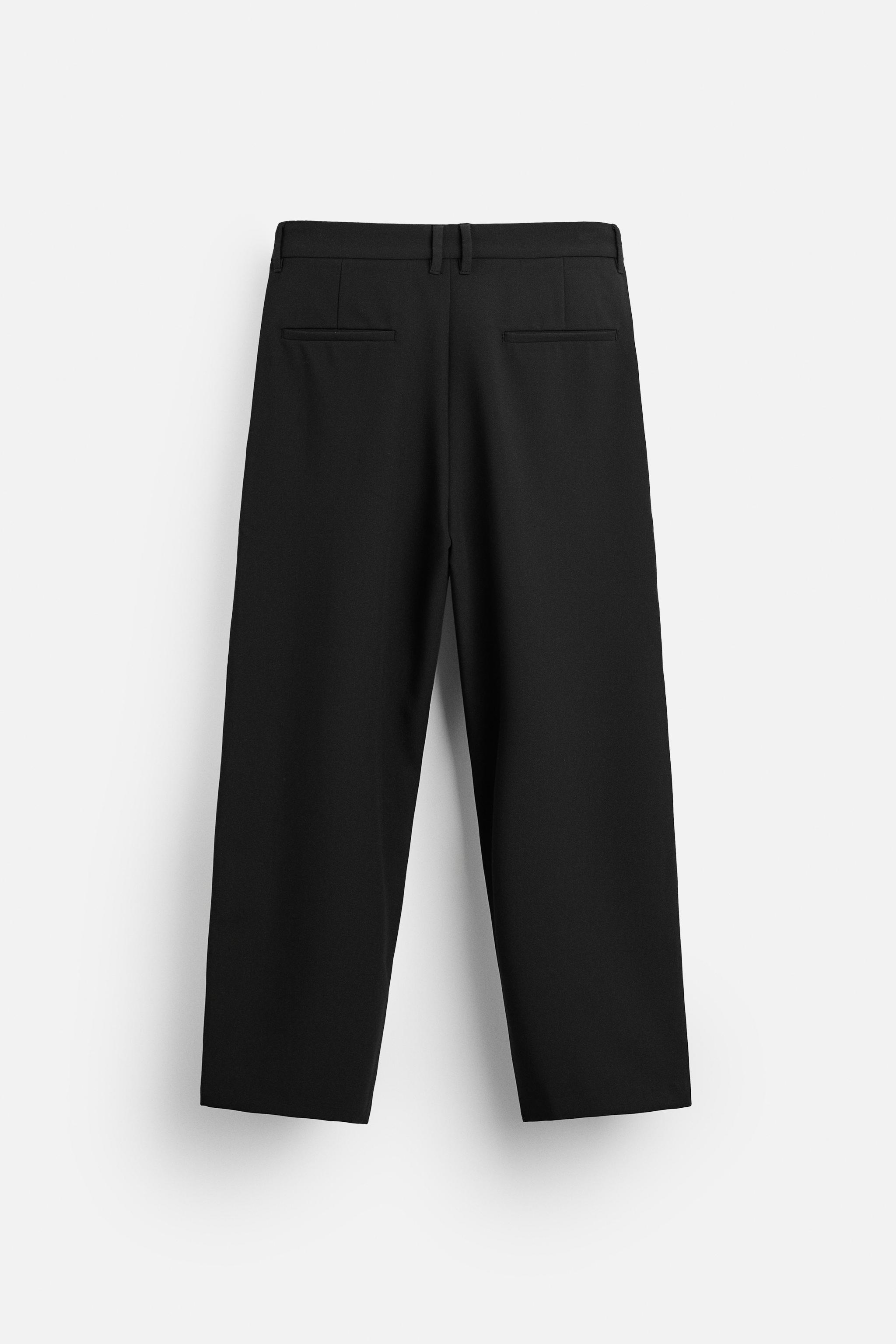 RELAXED FIT PLEATED PANTS