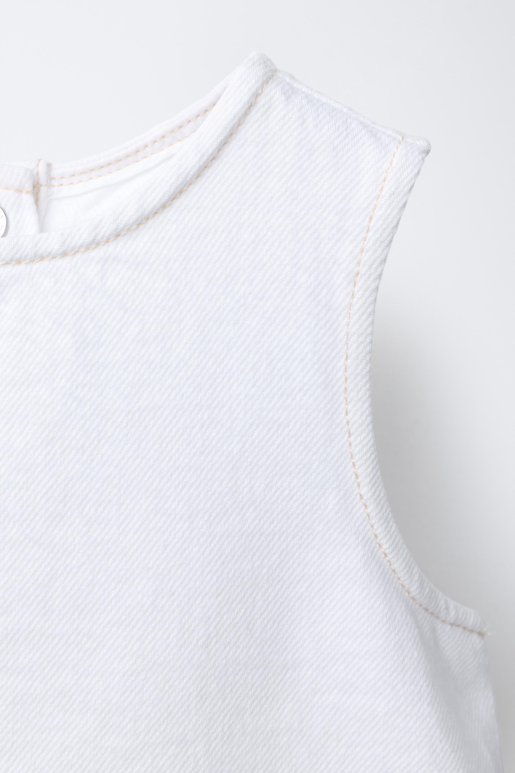 TOP EN DENIM À VOLANTS