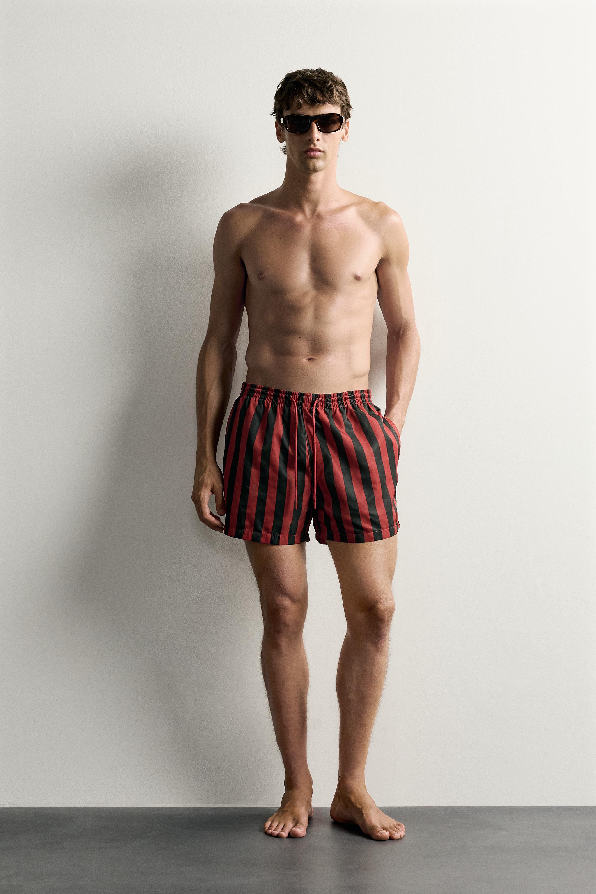 STRIPED MID-LENGTH SWIM SHORTS — Red