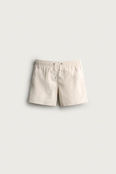 TEXTURED MID-LENGTH SWIM SHORTS — Ecru 1