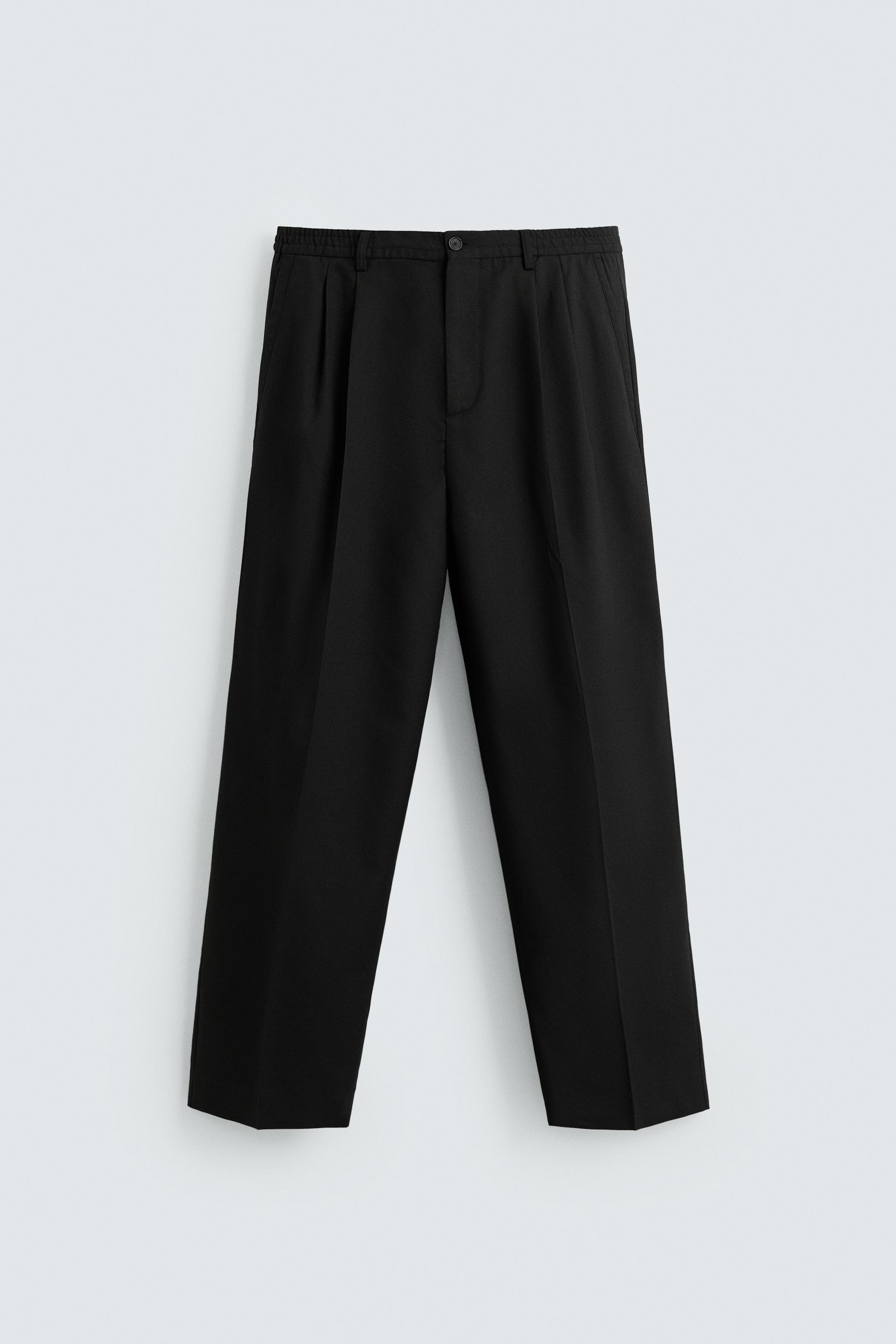 FLOWY PLEATED WIDE FIT PANTS