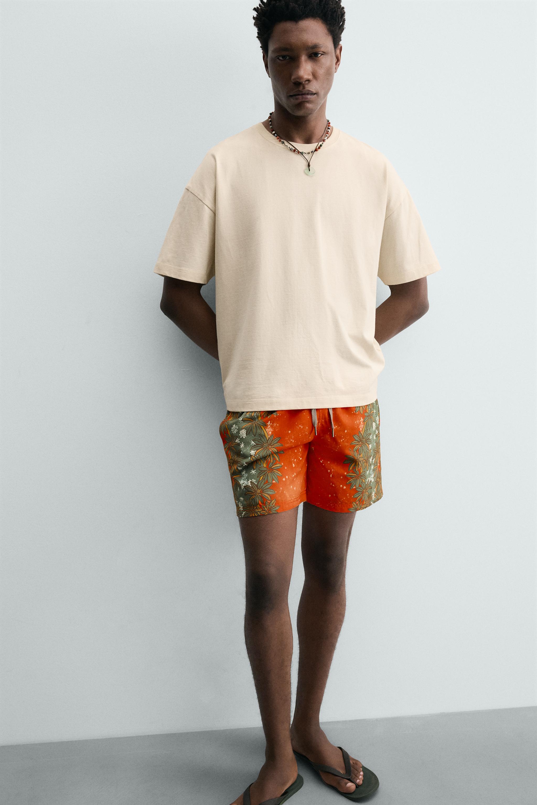 LONG FLORAL PRINT SWIM TRUNKS