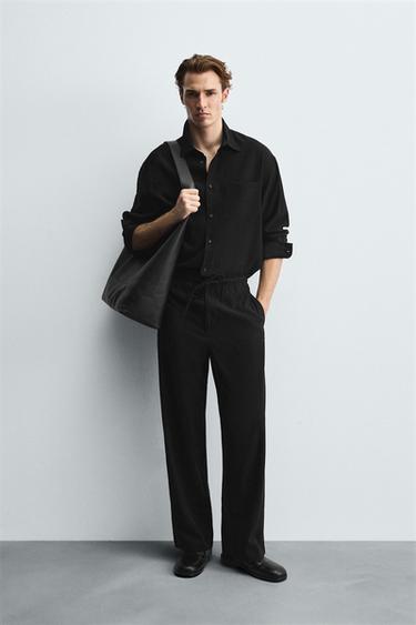 RELAXED FIT FLOWING TROUSERS - Black by Zara - Image 0