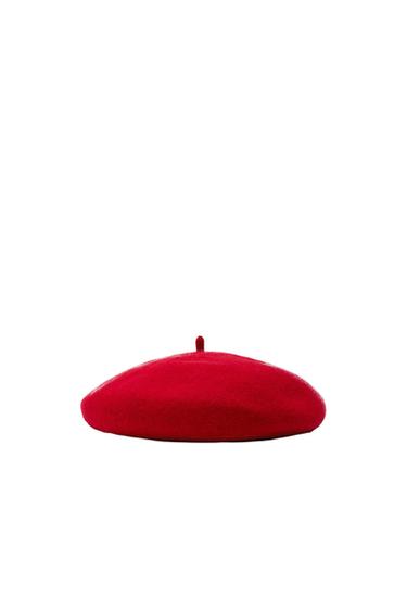 Red beret on a white background, centred in the image.