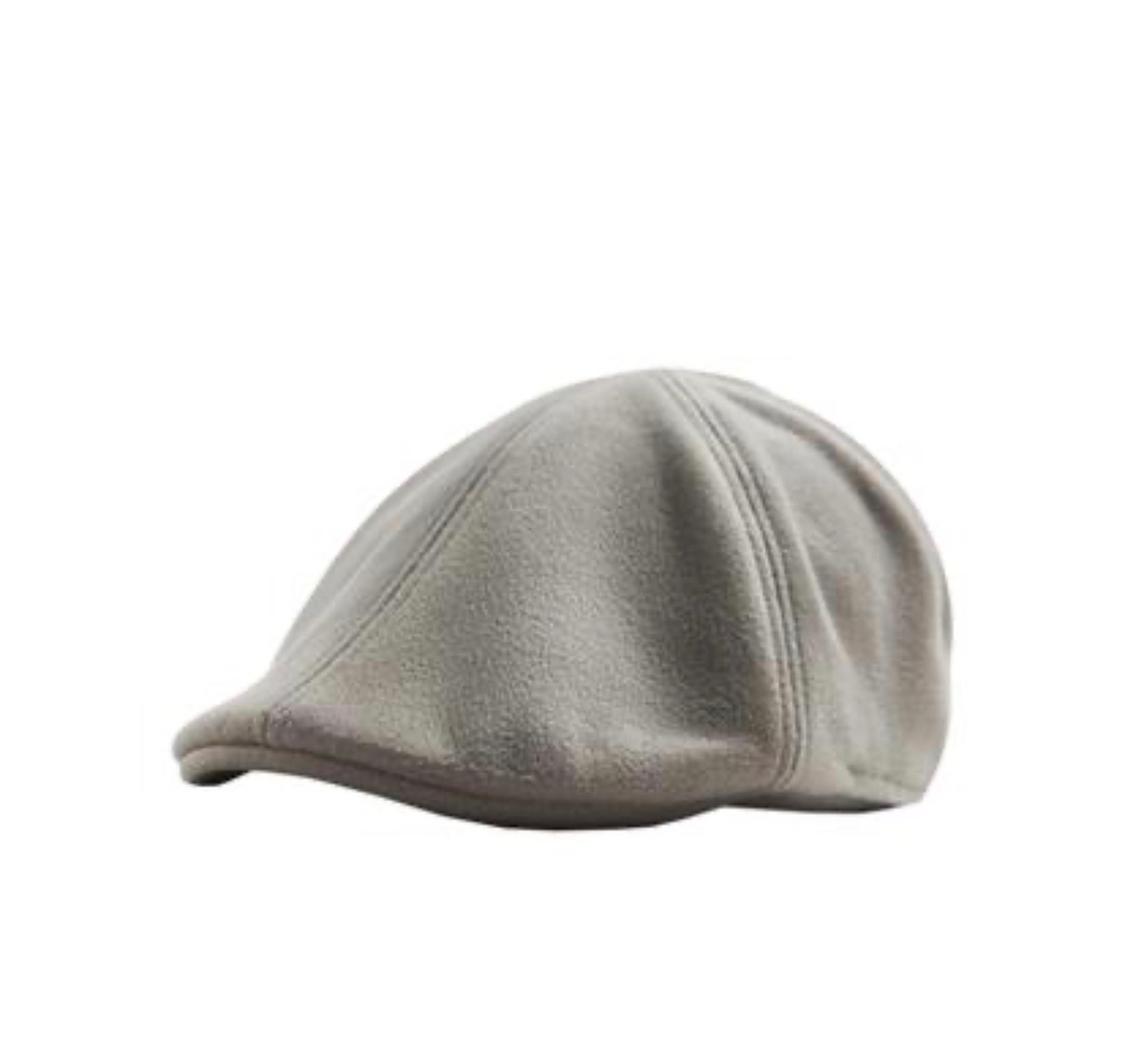 Grey flat cap on a white background, with visible stitching that gives it texture and shape.