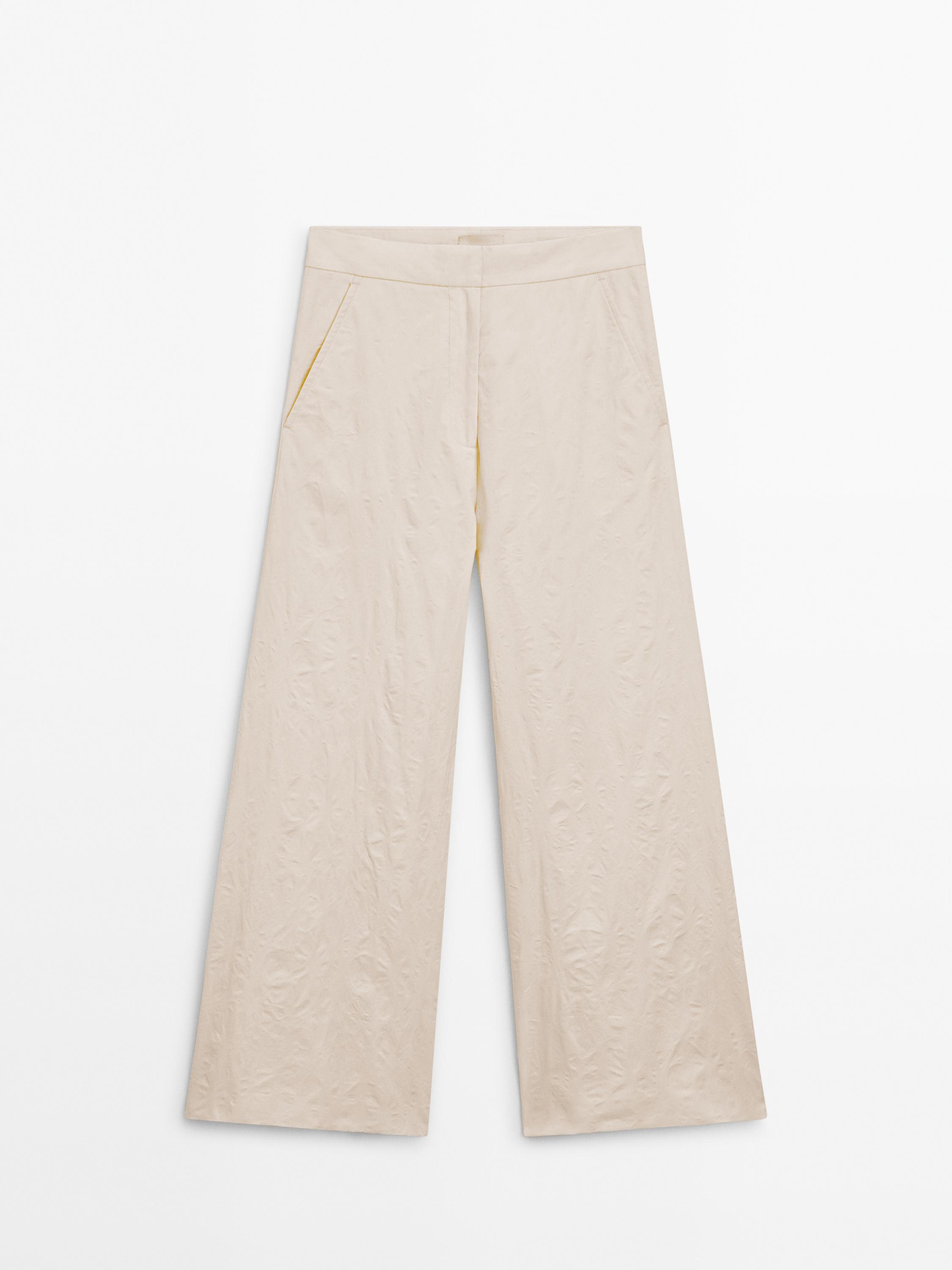 Creased-effect palazzo trousers - Limited Edition