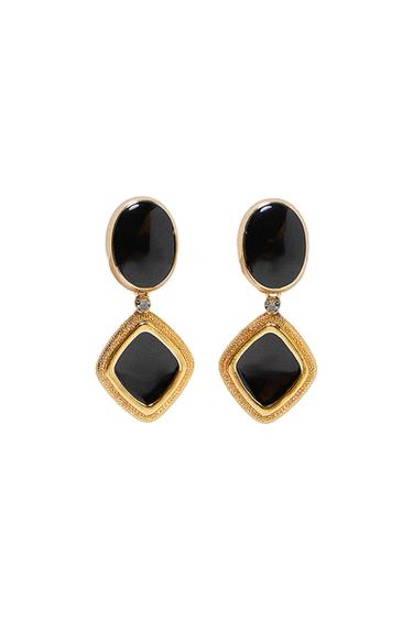 Gold earrings with black stones, oval and square design, on a white background.