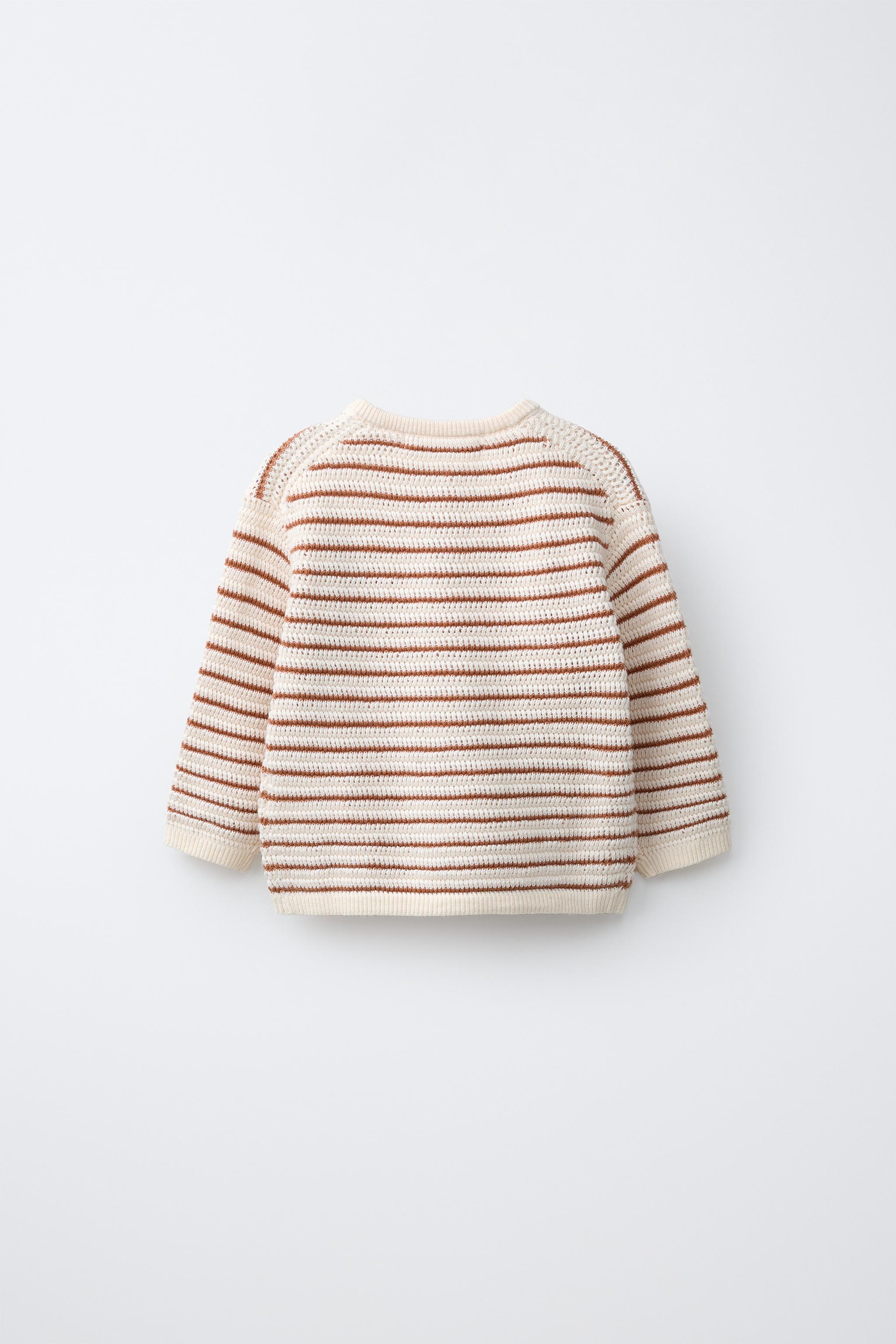 PULL EN MAILLE AVEC PIÈCE LION