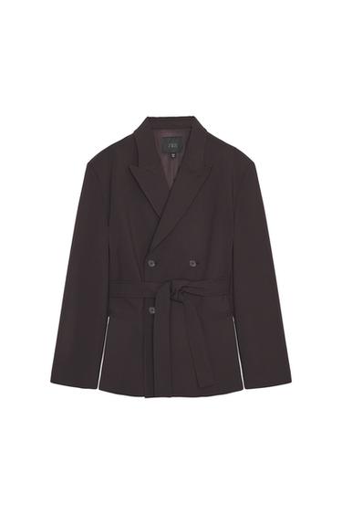 Front view of dark burgundy blazer with notched lapels, long sleeves, double-welt pockets and self-tie belt.