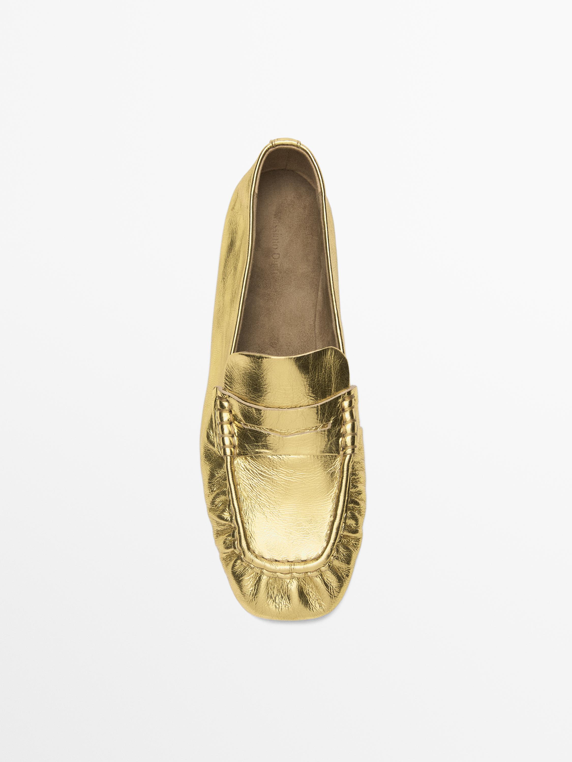 Mocassins dorés avec patte