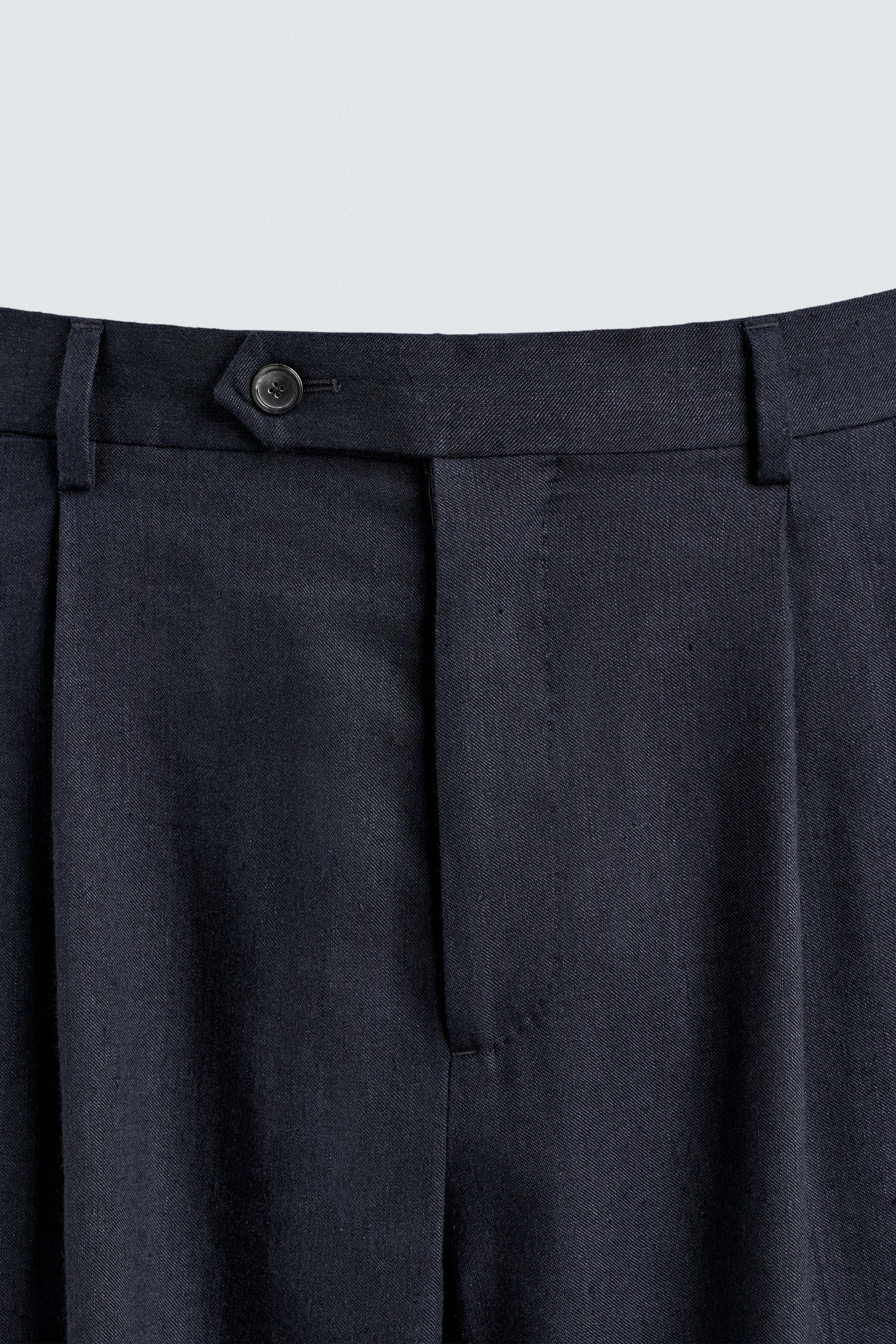 100% WOOL RELAXED FIT PLEATED PANTS