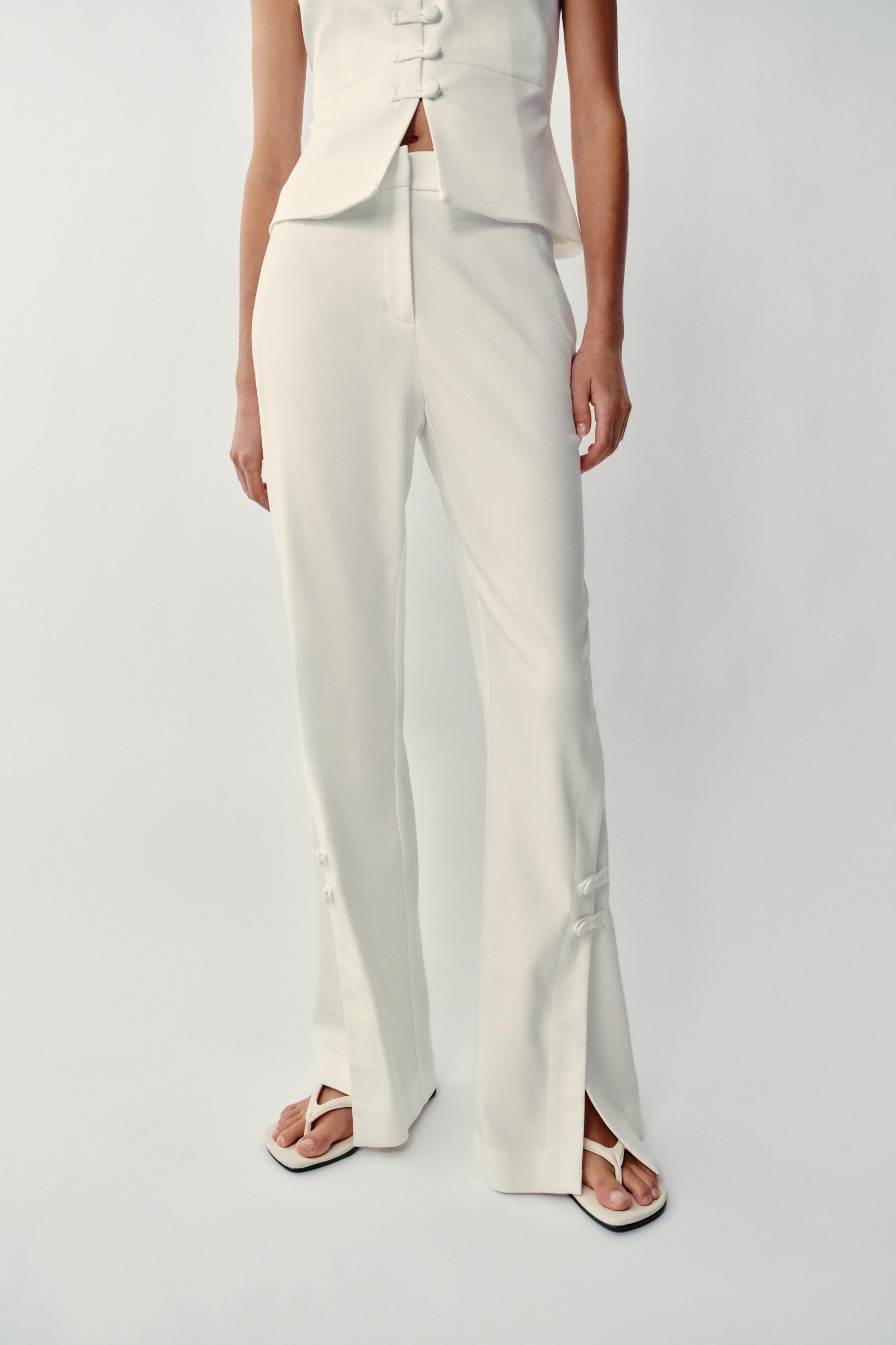PANTS WITH SLIT HEMS — Ecru
