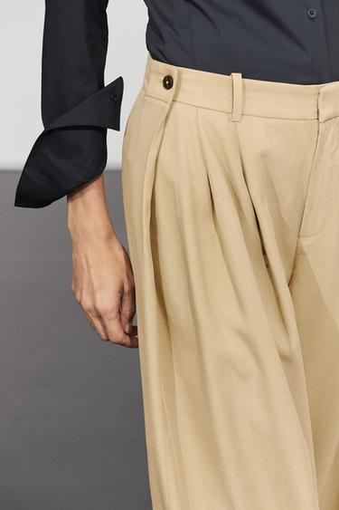 Flowing pleated pants with button detail — Beige 1