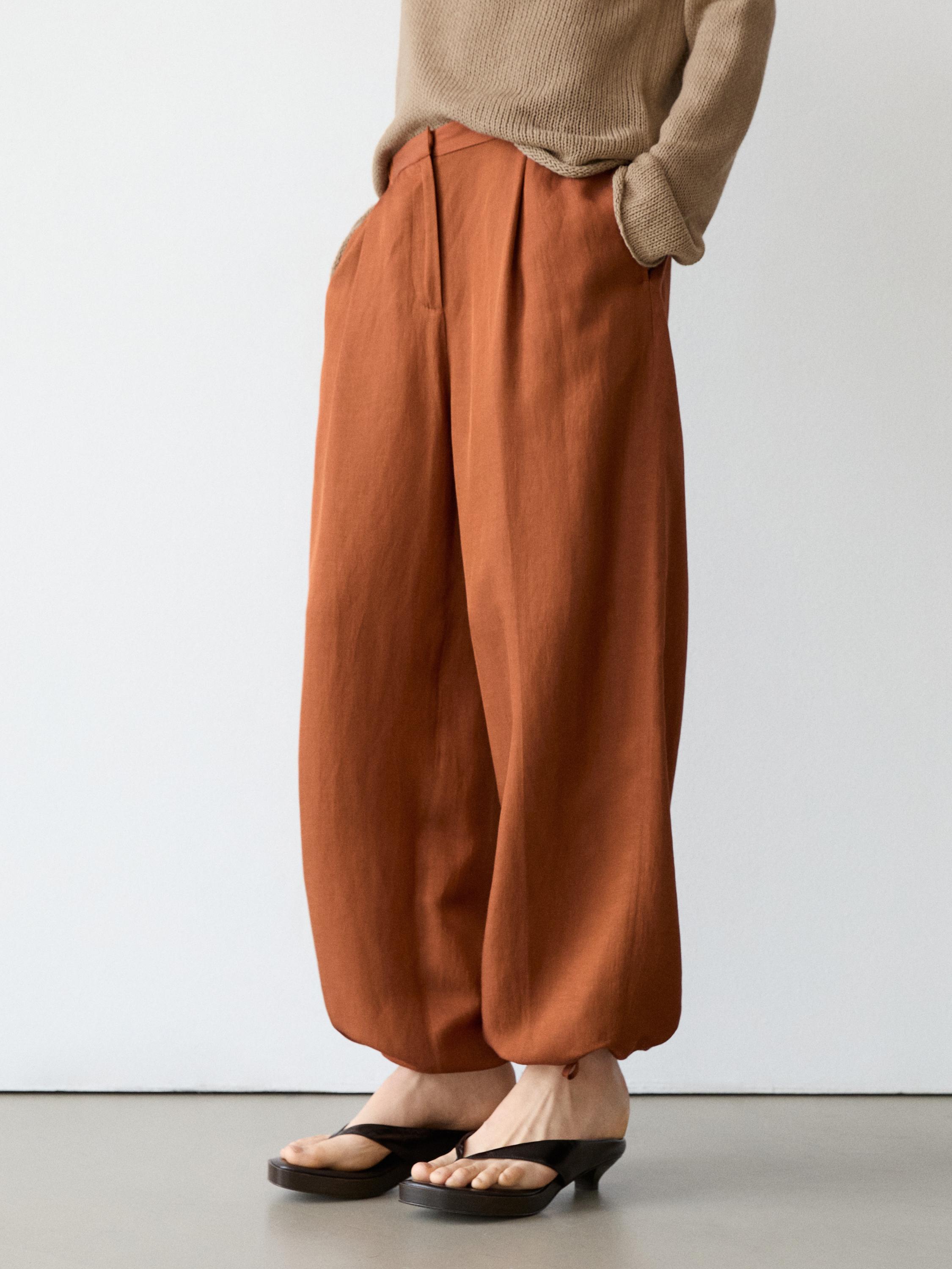 Flowing trousers with tie detail — Orange