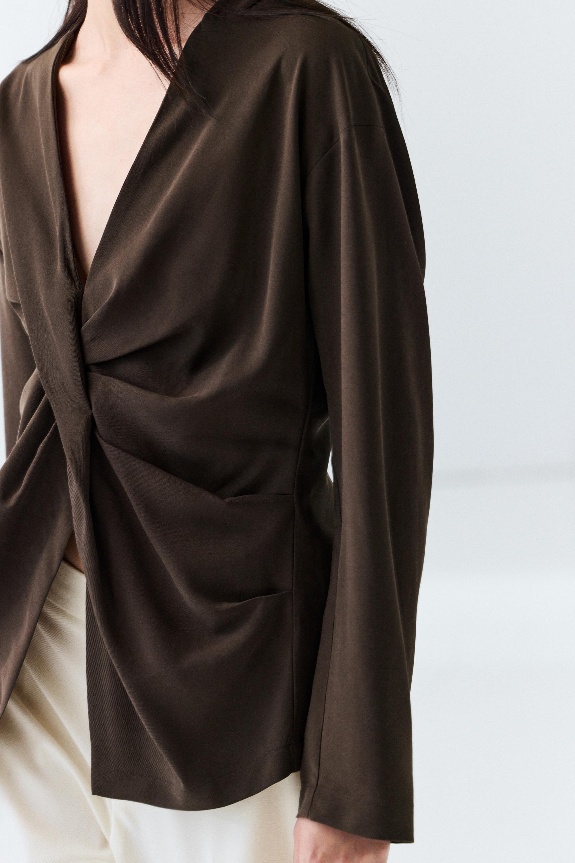 Flowing blouse with draped detail