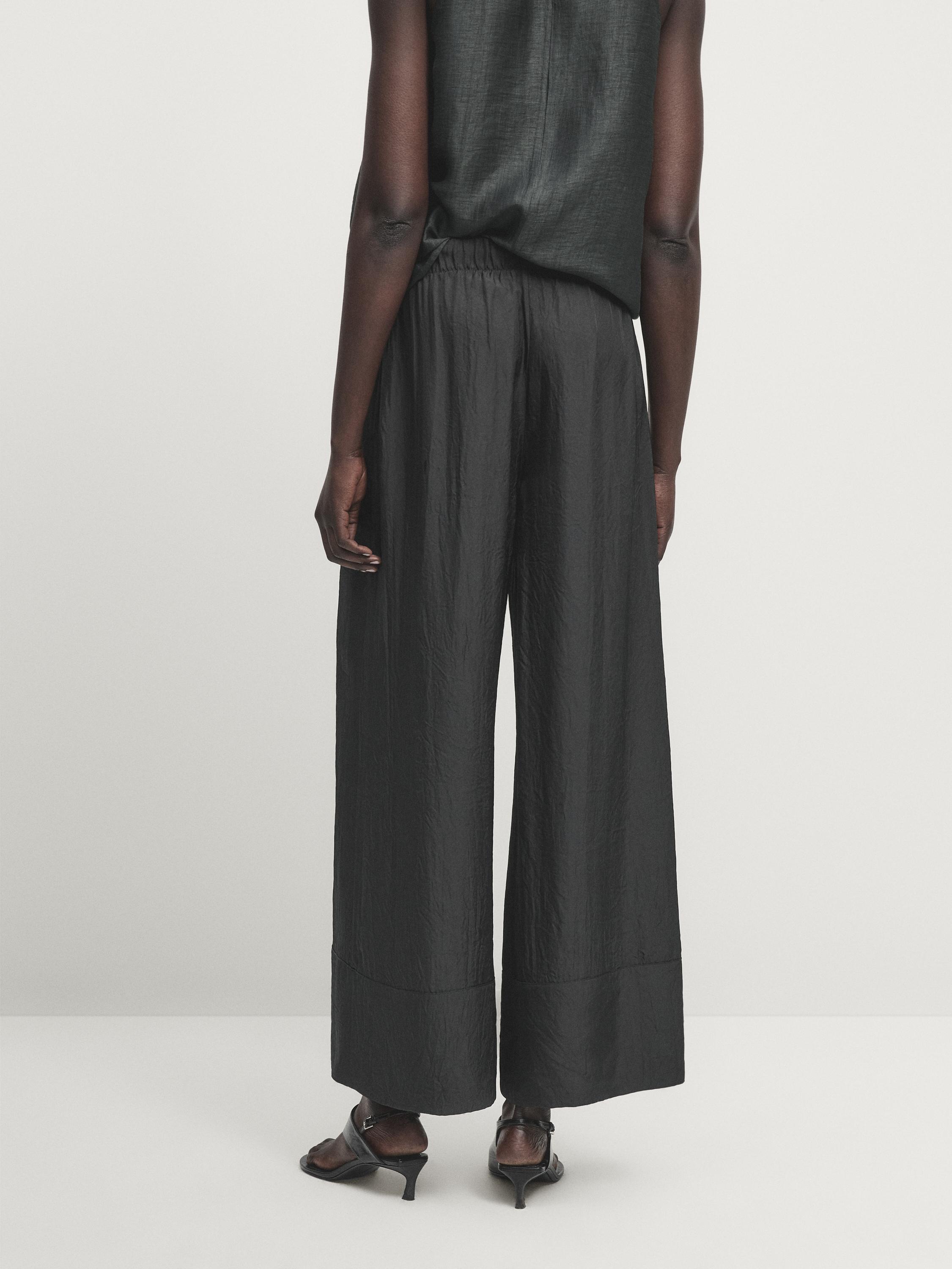 Satin trousers with elasticated waistband and double hems