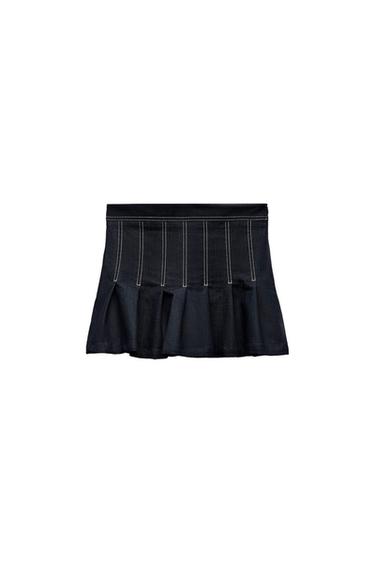 Navy blue mini skirt with panels and contrasting white stitch detailing on a white background.