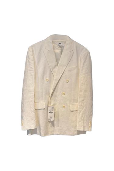 Cross-body white Americana jacket with buttons and flap-over pockets on a white background. Neck label with the text ZARA MAN SARTORIAL.