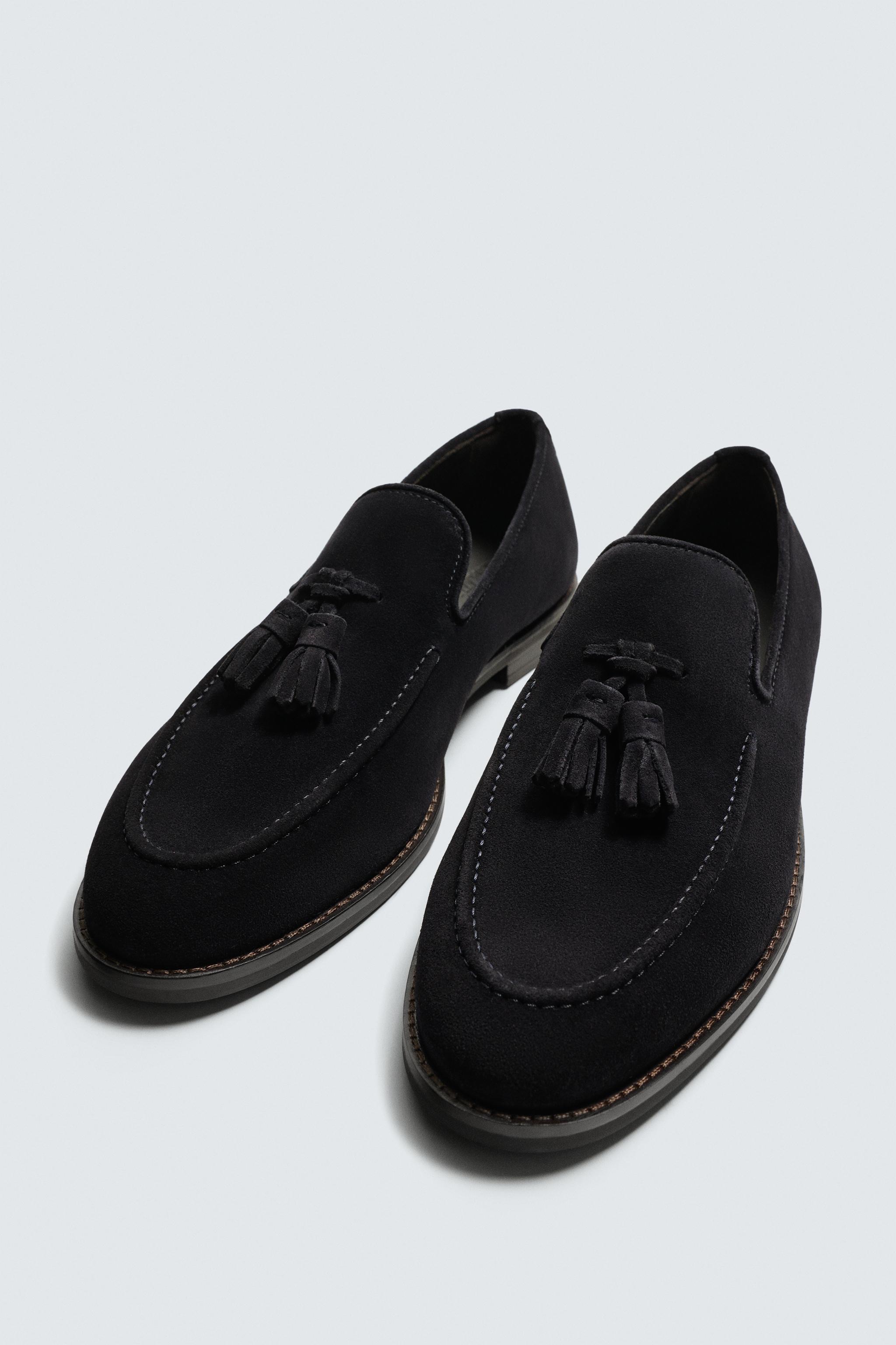 MOCASSINS EN CUIR À POMPONS