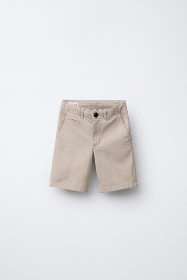 برمودا تشينو SLIM FIT بيزك - بيج فاتح الخاص بـ Zara