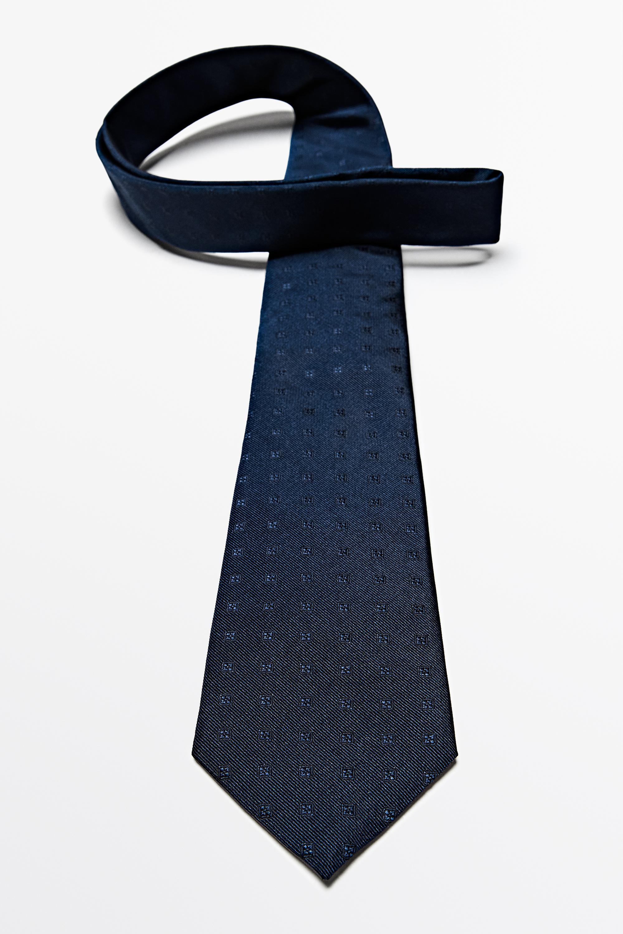 100% silk tie with embroidered detail