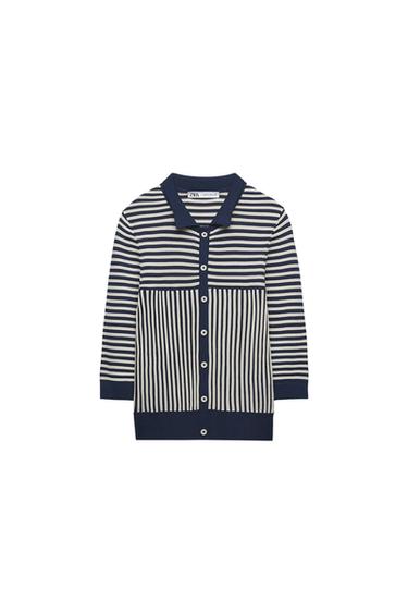Button-up knit polo shirt with horizontal and vertical stripes in navy blue and white. Label with Zara text. White background.
