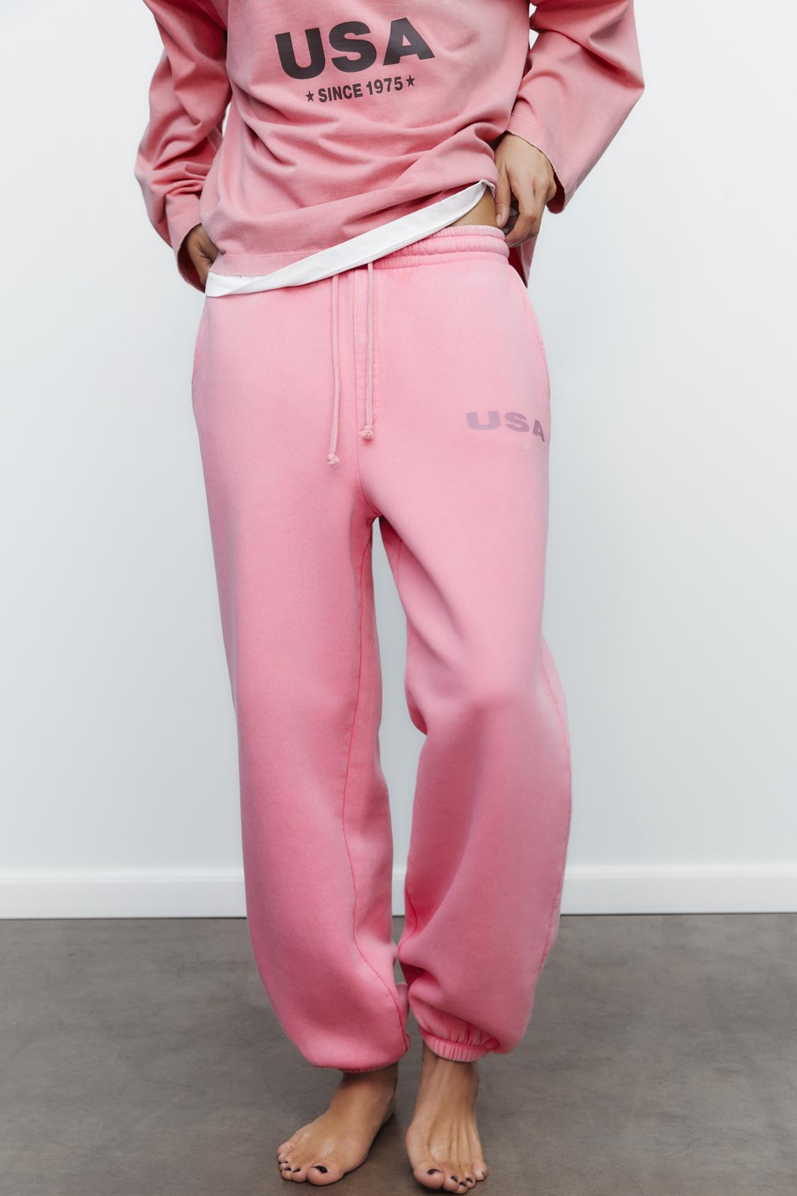 WASHED-EFFECT PLUSH TROUSERS WITH SLOGAN