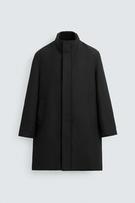Front view of grey coat with detachable stand collar, concealed zip fastening, side pockets and back vent.
