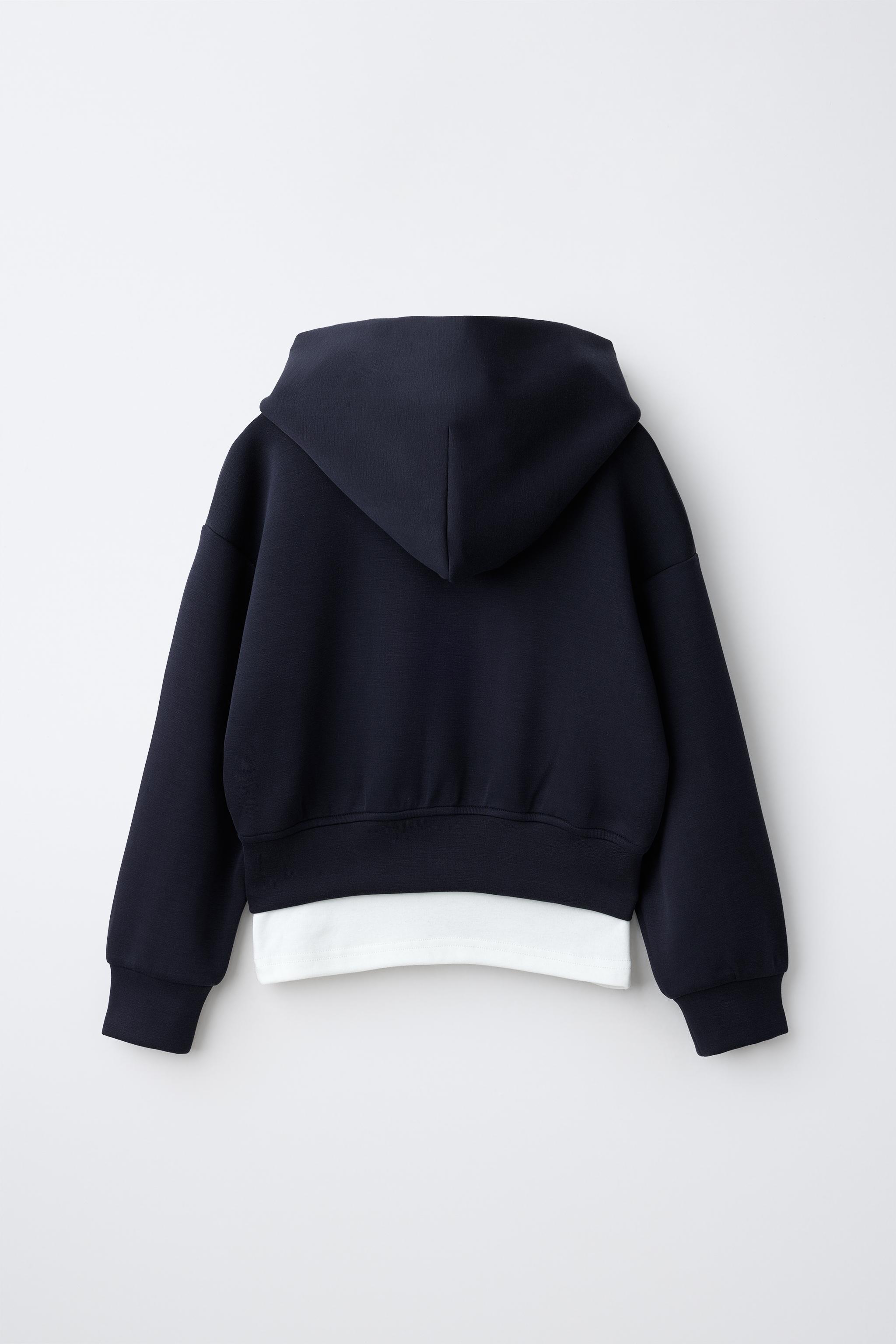 SUDADERA SPORTY CAPUCHA DOBLE BAJO