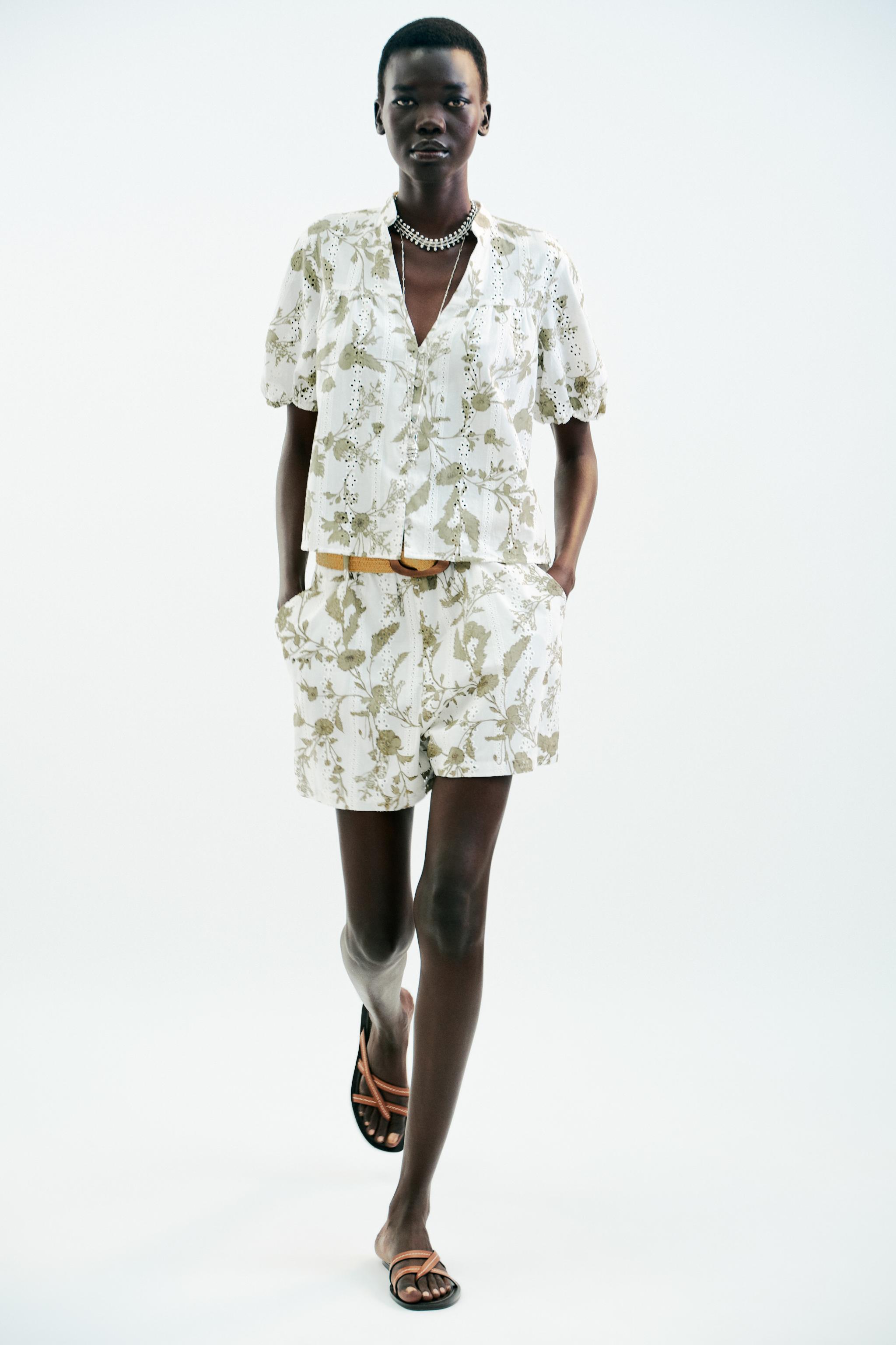 PRINTED TOP WITH EMBROIDERED EYELETS