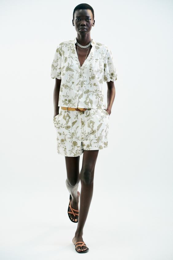 PRINTED TOP WITH EMBROIDERED EYELETS