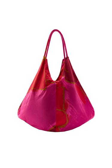 Front view of pink bag with abstract print in black