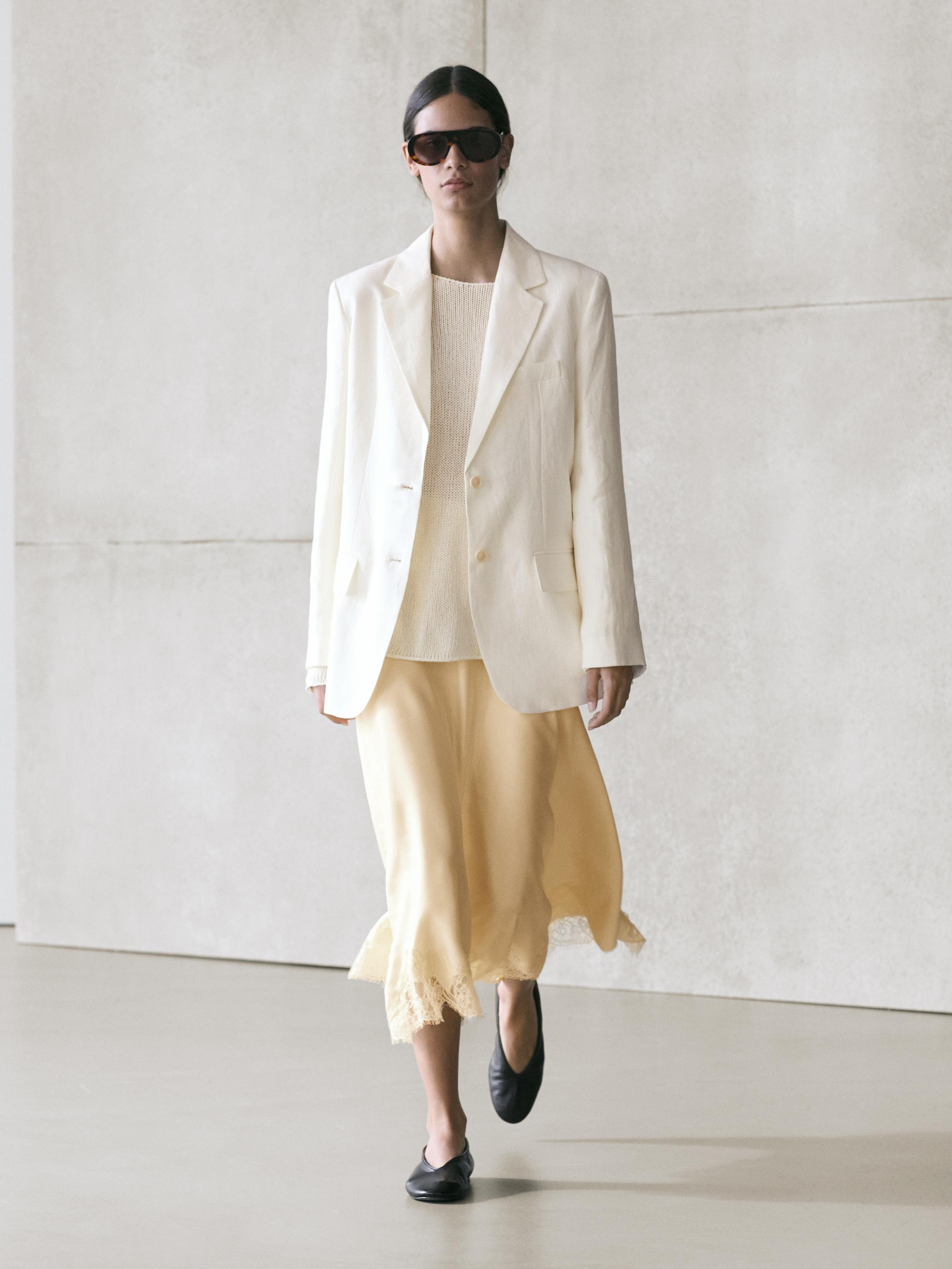 Asymmetric skirt with lace-trimmed detail