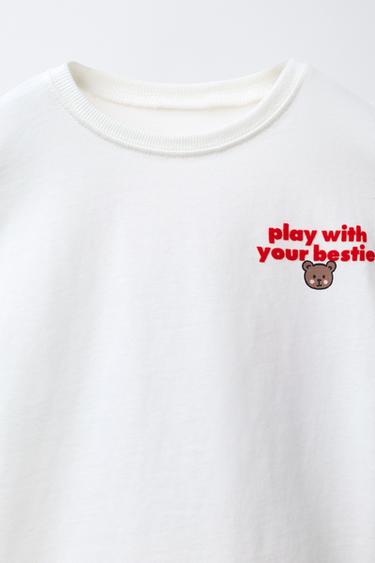 T-SHIRT AVEC INSCRIPTION FLOQUÉE - Blanc de Zara - Image 2